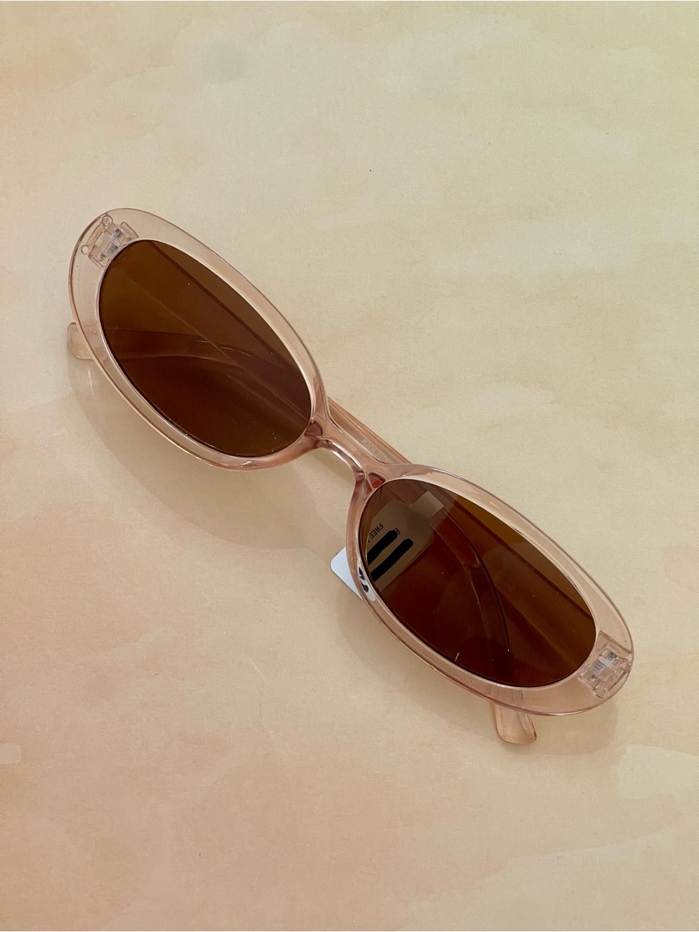Free People Translucent Pink Slim Oval Sunglasses with Brown Lenses